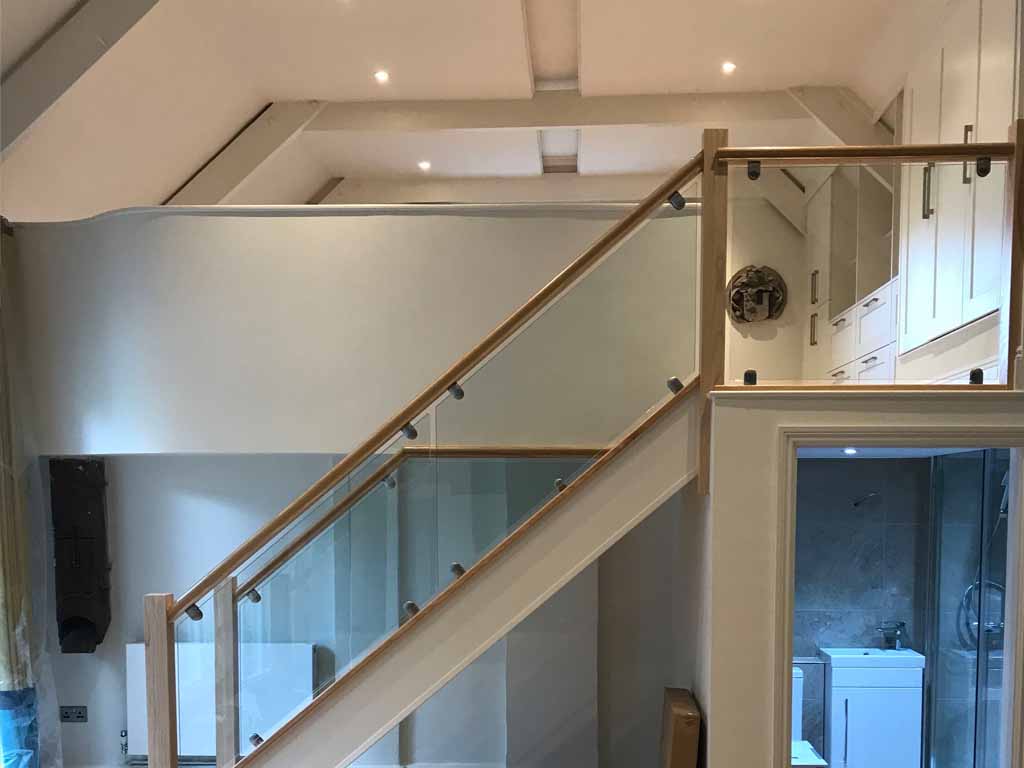 Renovation and refurbishment work with bespoke staircase done by Olding Developments in Courtlands
